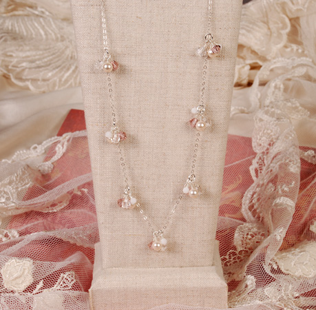 Crystal and pearl wedding necklace on display